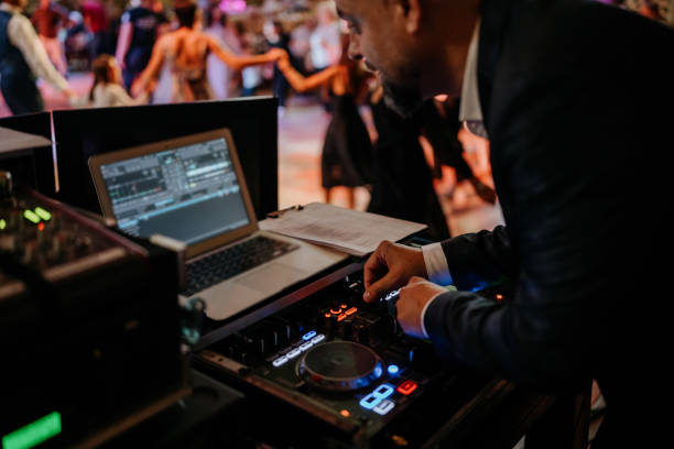 istock DJ working at a business party 1682519981