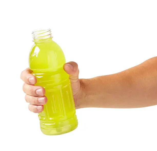 Hand holding sports drink, larger files come with clipping path.