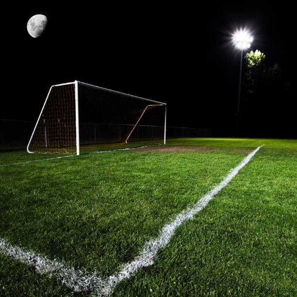 istock Illuminated soccer goal and field at night 168252232