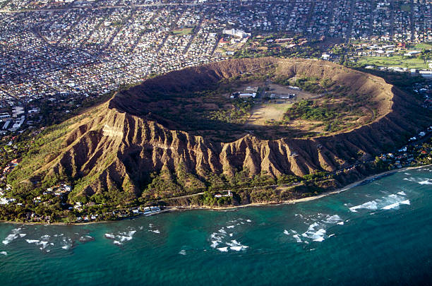 Diamond Head, Oahu, Hawaii aerial view into crater Aerial view of Diamond Head crater, a tuff crater on Oahu, Hawaii, USA. National Guard facility in crater. honolulu stock pictures, royalty-free photos & images