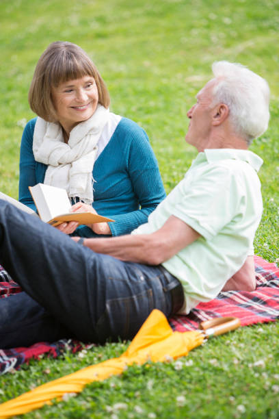 istock Senior Couple Relaxing in the Park 168252670