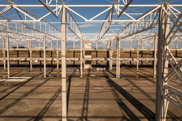istock Drone photography of new warehouse metal frame and construction site under development 1682528192