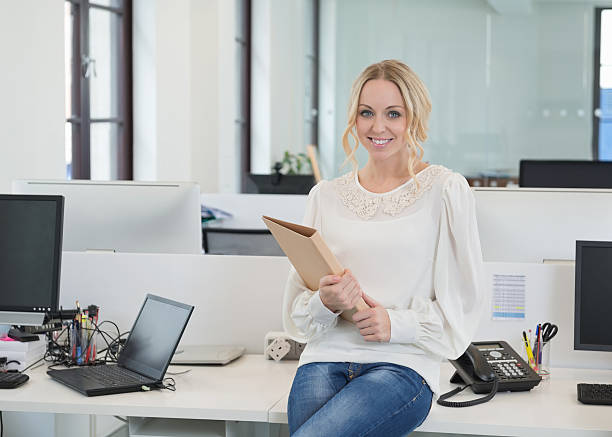 istock Beautiful Businesswoman At Computer Desk 168252963