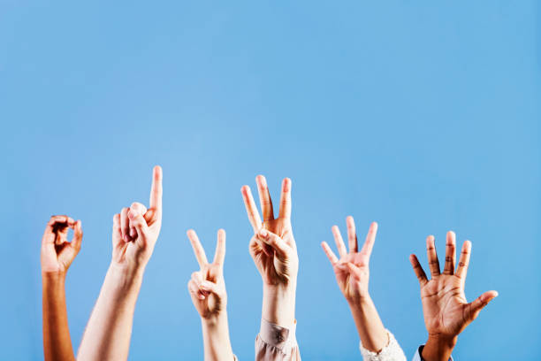 istock Six hands count from 0 to 5 against blue background 168252971
