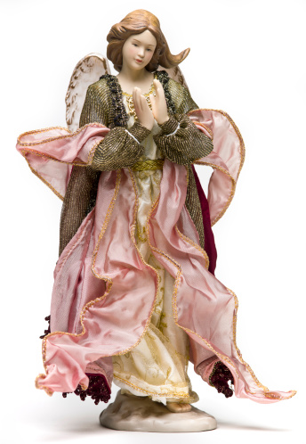 Old Figurine representing the archangel Gabriel  on white background (this picture has been taken with a Hasselblad H3D II 31 megapixels camera)-