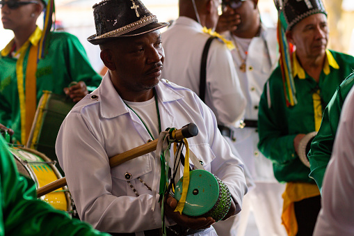 Goiânia, Goias, Brazil – September 10, 2023:  Detail of some revelers with their percussion instruments at the Congadas in Goiânia.