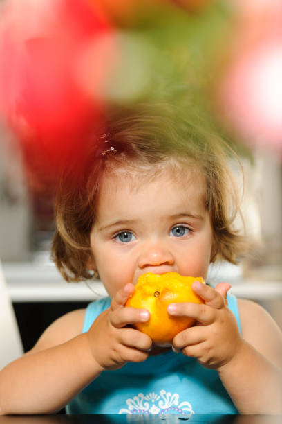 istock girl eating nectarine 168253554