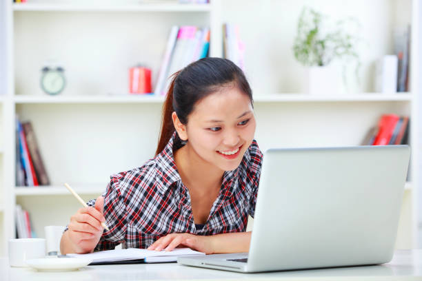 istock one young asian woman working with laptop 168253562