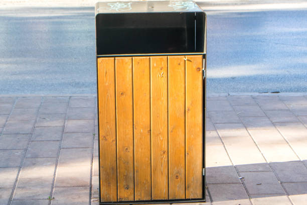 istock brown carbage can in a street 1682542417