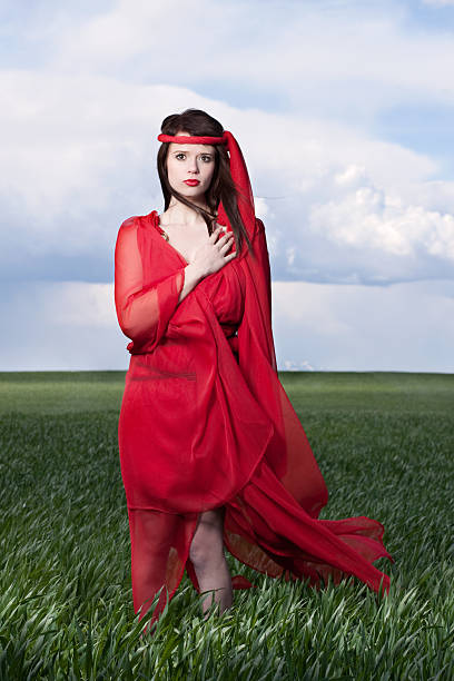 istock Woman in Red Outdoors with Hand Over Heart 168254857