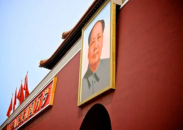 The portrait of Mao Tse-tung hanging over the entrance to The Forbidden City from Tiananmen Square, Beijing, China.