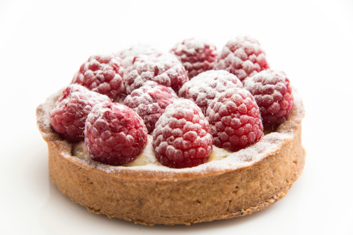 Raspberry tart on white background