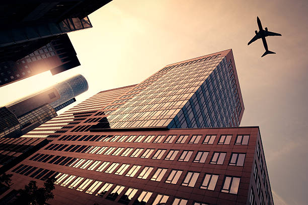 istock Business towers with a airplane silhouette 168257709