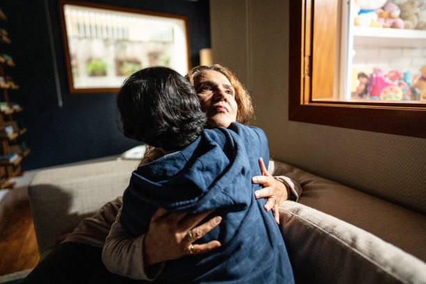 istock Mother embracing and consoling sad son at home 1682581665