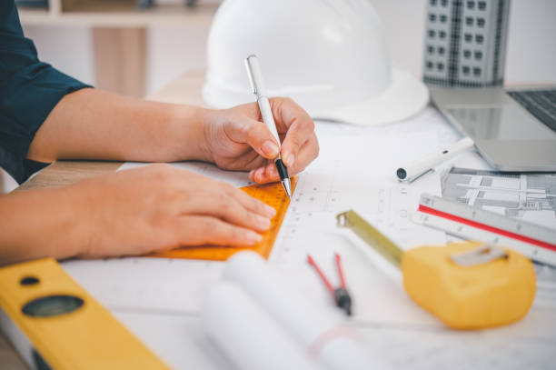 istock engineer working in office with blueprints, inspection in workplace for architectural plan, construction project ,Business construction 1682586800