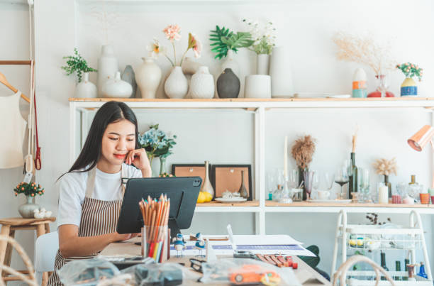 istock Small business owners are preparing a small shop and checking through a tablet and checking orders. 1682588463