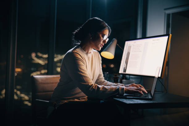 istock Creative businesswoman typing on her laptop during a night shift 1682591165