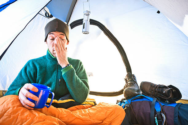 Waking up in a tent stock photo