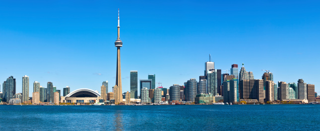 Toronto, Canada – May 26, 2023: A scenic view of Toronto, Canada, featuring the city's impressive skyline of high-rise buildings, seen from the waterfront