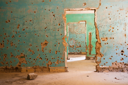 Interior view of the abandoned and bullet-scarred hospital in Quneitra, Syria. Quneitra was occupied by Israel for seven years beginning in 1967. Today, though decades have passed since the Israeli withdrawal, the town has been left in its destroyed state.