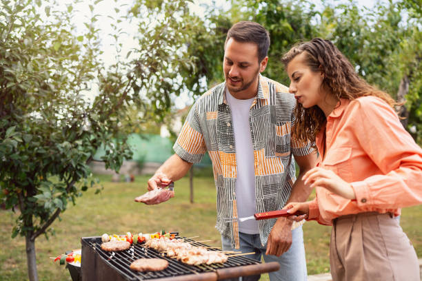 istock Young Caucasian couple making barbecue 1682603920