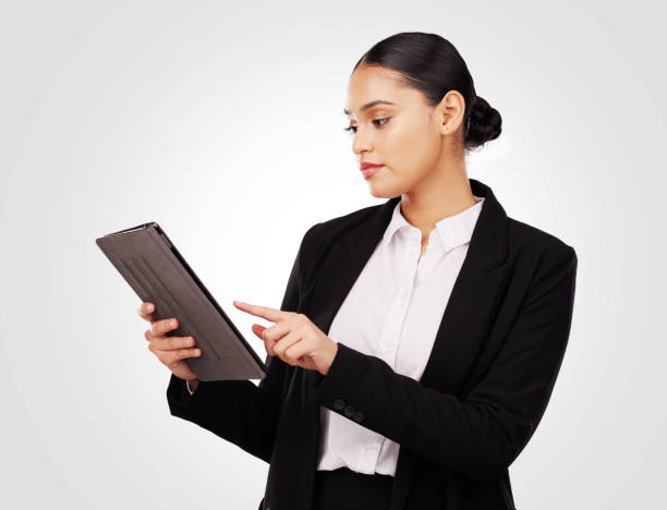 studio, woman and lawyer working with tablet for online news, research and work information on website or white background. reading, mobile app and typing law notes, report or email feedback - newspaper digital tablet digitally generated image note pad imagens e fotografias de stock