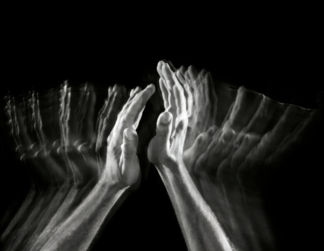 applauding hands, motion picture done in the studio on a black background.