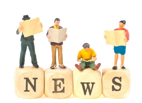 The word news with little people on it