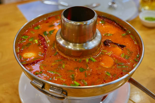 istock Traditional Thai Dish Tom Yum Goong Cooked in a Pot 1682618181