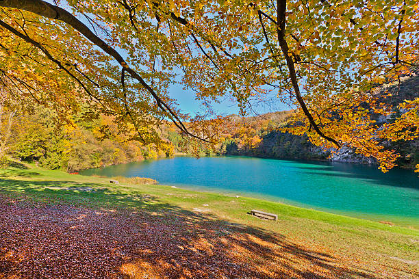 The small alpine Lake Lamar is one of the many lakes in the Valley of the Lakes, in the province of Trento. Together with the nearby Lake Santo, is set among lush woods, at the end of a narrow little valley at the foot of the Dolomite Group of Paganella. It is rich in fish and shallow waters make it suitable for bathing. 