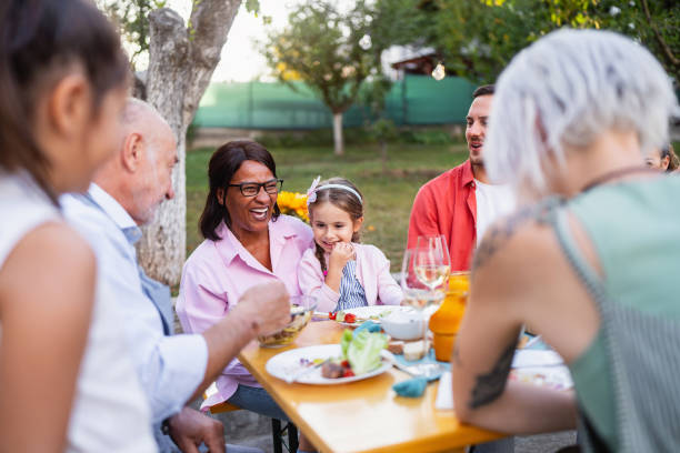 istock Multiracial and multi-generation families enjoying family brunch 1682629708