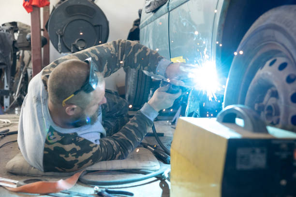 istock The mechanic welds a new threshold to a car. 1682630251