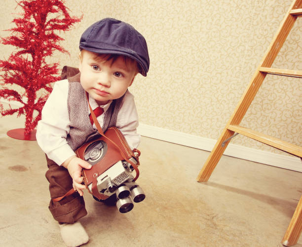 toddler boy portrait with video camera
