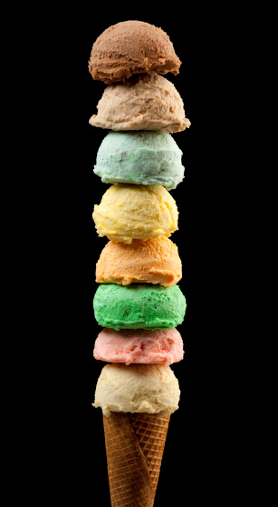 Huge Eight scoops ice creams with cone on Black Background.