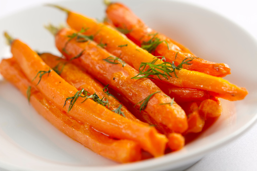 Oven roasted whole carrots, buttered and topped with fresh dill.
