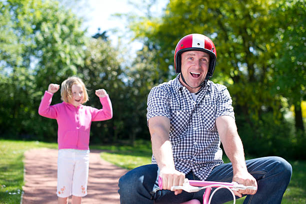 Dad learns to ride a bike