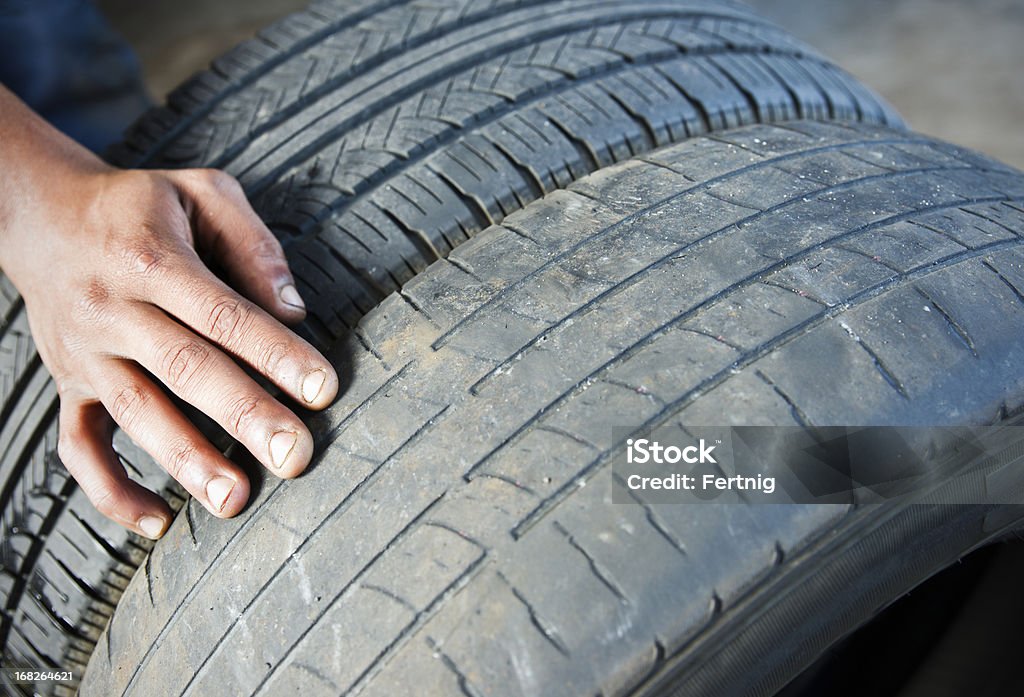 Comparing tire wear A photograph comparing a dangerously worn tire beside a newer tire with acceptable tread. Tire - Vehicle Part Stock Photo