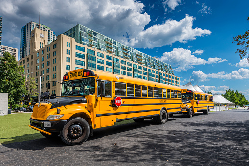 Toronto, Canada - August 31, 2022: schoolbuses standing in a row in the streets of Toronto in Canada