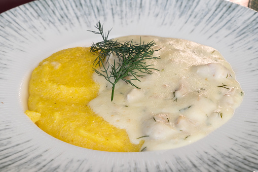 Meat stew with cream and polenta in Romania