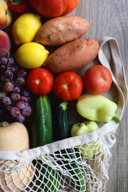 istock Mesh Bag with Seasonal Fruit and Vegetable 1682655038