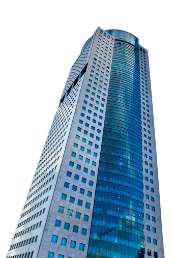 A skyscraper isolated on white background, shot from a low angle.