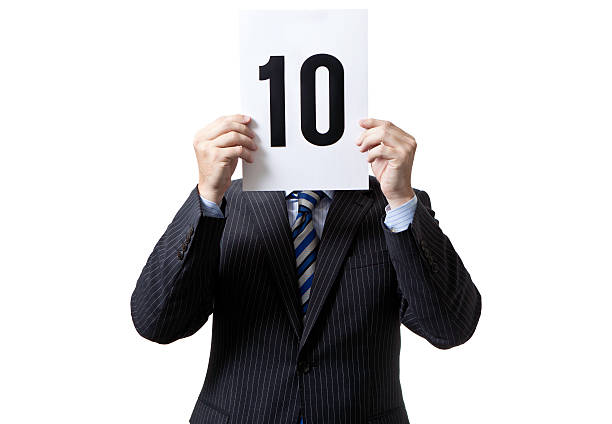 Mr 10 Businessman holding sign number 10 sign stock pictures, royalty-free photos & images