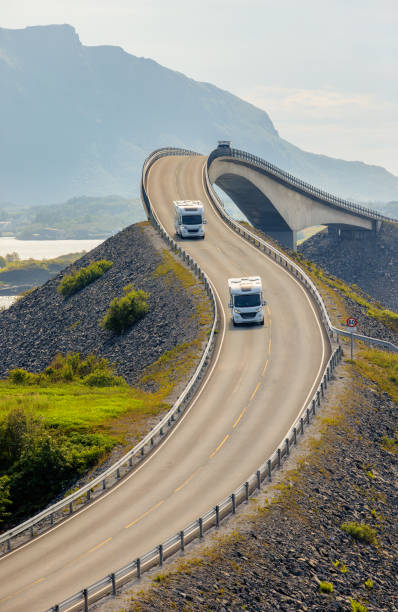 Caravan car RV travels on the highway Atlantic Ocean Road Norway. stock photo