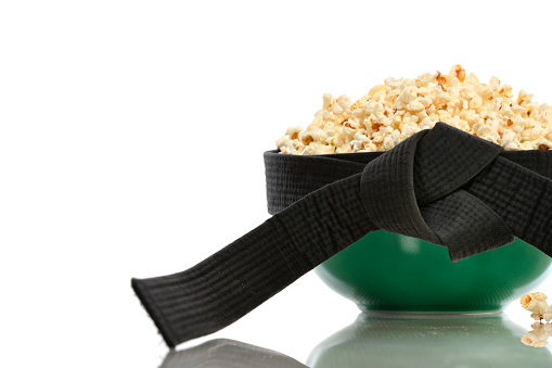 Bowl of popcorn with a martial arts black belt.