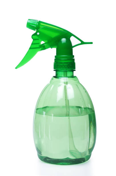 Green clear water sprayer on a white background