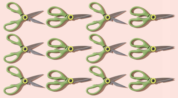 istock Pattern of open and closed kitchen scissors on a pale pink background. 1682685101