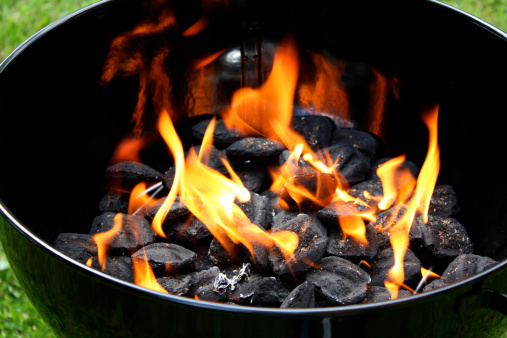 charcoal fire inside a barbeque