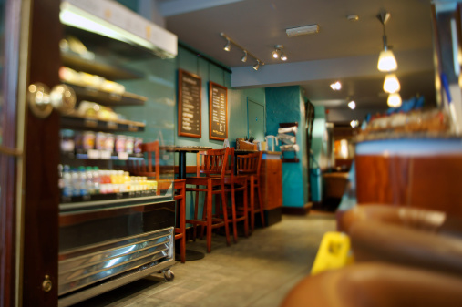 Interior of a café bar situated in the United Kingdom, colorfully decorated and welcoming. Blurred and bokeh details hide parts
