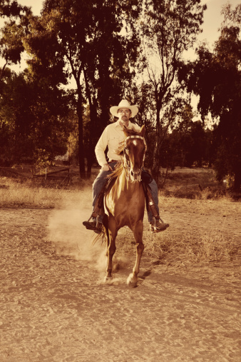 Portrait of a cowboy riding his horse. You might also be interested in this: