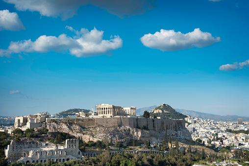 Athens, Greece - December 29 2023: The Stoa of Attalos and the Ancient Agora, with the Acropolis on top of the Acropolis Hill in the background.